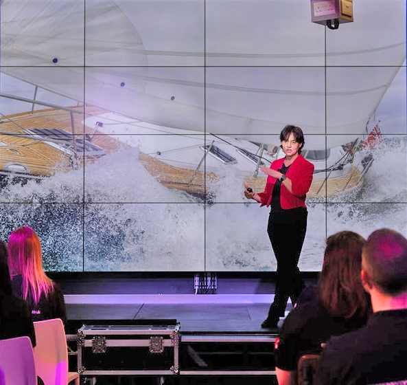 Sue delivering a Keynote speech on Adaptable Leadership: Navigating Change and Uncertainty